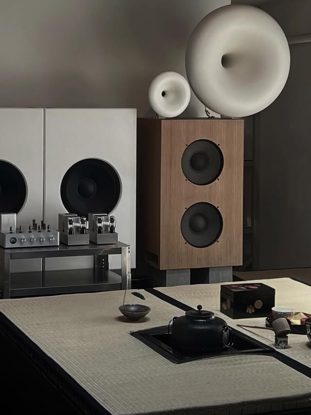 A listening room with horn speakers and a tea table