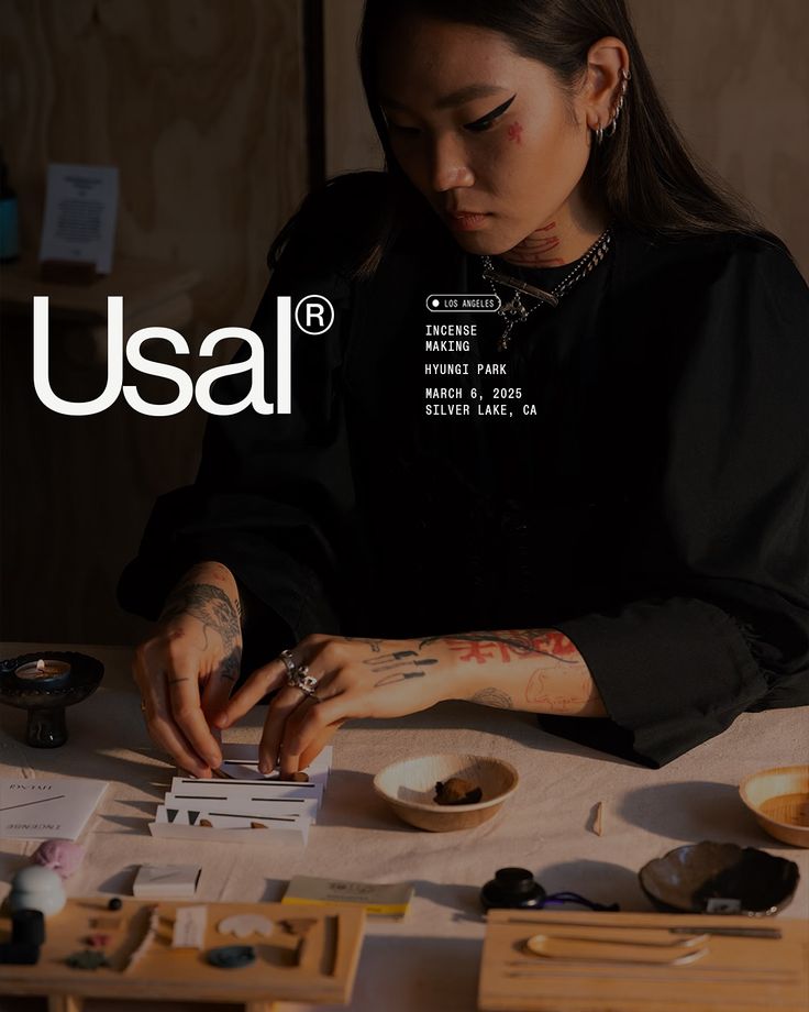 Rolling incense by hand at a workshop table